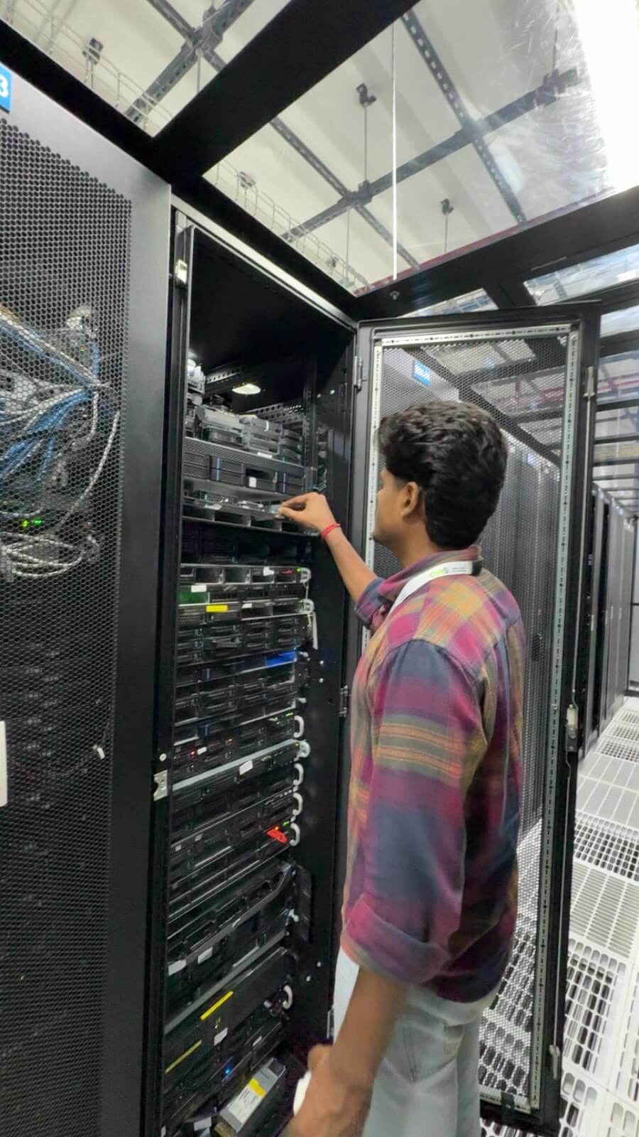eWebGuru staff installing a server into a rack during provisioning